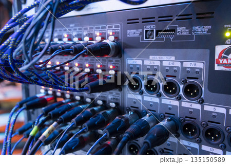 Switching stage equipment on the stage of a concert hall Switching stage equipment on the stage of a concert hall 135150589