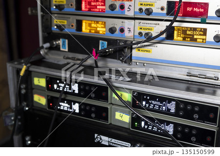 Switching stage equipment on the stage of a concert hall Switching stage equipment on the stage of a concert hall 135150599