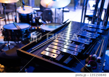 Percussion instruments, metallophone, xylophone are set up on the stage of the concert hall 135150640