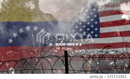 usa and venezuela flags behind barbed wire against a smoke background 135151061