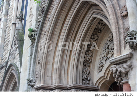 Oxford, United Kingdom - Dec 22, 2025: Wesley Memorial Church, a Methodist church in central Oxford. Tympanum above the entrance, decorated with stone carvings. 135151110