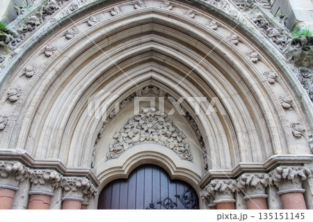 Oxford, United Kingdom - Dec 22, 2025: Wesley Memorial Church, a Methodist church in central Oxford. Tympanum above the entrance, decorated with stone carvings. Oxford, United Kingdom - Dec 22, 2025: Wesley Memorial Church, a Methodist church in central Oxford. Tympanum above the entrance, decorated with stone carvings. 135151145