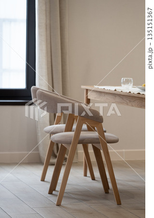 Modern dining chairs inviting to sit and enjoy a meal 135151367