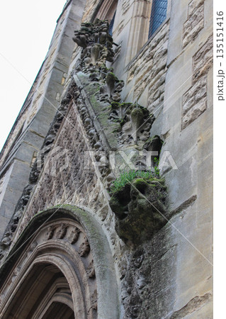 Oxford, United Kingdom - Dec 22, 2025: Wesley Memorial Church, a Methodist church in central Oxford. Tympanum above the entrance, decorated with stone carvings. Oxford, United Kingdom - Dec 22, 2025: Wesley Memorial Church, a Methodist church in central Oxford. Tympanum above the entrance, decorated with stone carvings. 135151416
