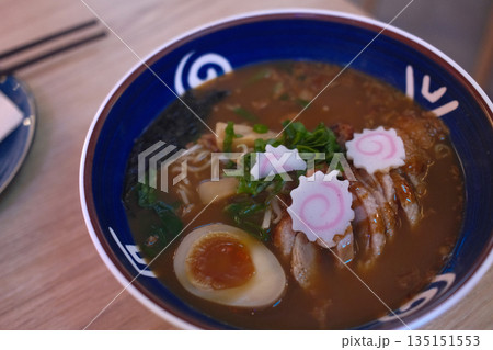 A delicious bowl of traditional Japanese ramen with pork, egg, noodles, and flavorful broth. A delicious bowl of traditional Japanese ramen with pork, egg, noodles, and flavorful broth. 135151553