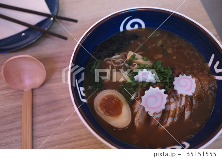 A delicious bowl of traditional Japanese ramen with pork, egg, noodles, and flavorful broth. A delicious bowl of traditional Japanese ramen with pork, egg, noodles, and flavorful broth. 135151555
