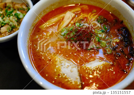 A delicious bowl of traditional Japanese ramen with pork, egg, noodles, and flavorful broth. 135151557