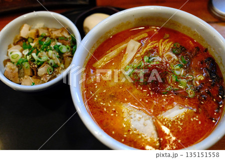 A delicious bowl of traditional Japanese ramen with pork, egg, noodles, and flavorful broth. 135151558