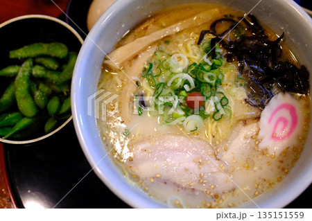 A delicious bowl of traditional Japanese ramen with pork, egg, noodles, and flavorful broth. A delicious bowl of traditional Japanese ramen with pork, egg, noodles, and flavorful broth. 135151559