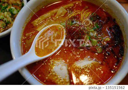 A delicious bowl of traditional Japanese ramen with pork, egg, noodles, and flavorful broth. 135151562