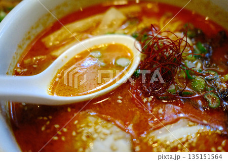 A delicious bowl of traditional Japanese ramen with pork, egg, noodles, and flavorful broth. A delicious bowl of traditional Japanese ramen with pork, egg, noodles, and flavorful broth. 135151564