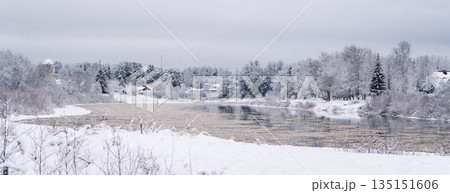 Winter Landscape with Snow-Covered River and Trees 135151606
