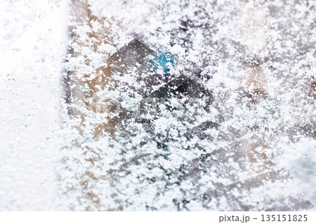 City lights glow, Apartment window reveals vivid scene with glowing cityscape and icy details 135151825