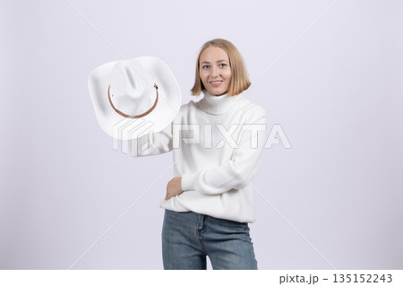 Woman holding a framed empty white board for copy space. Woman holding a framed empty white board for copy space. 135152243