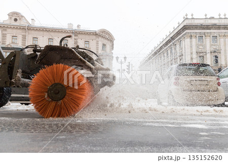 Snowplow truck vehicle removing snow after blizzard and snowstorm. Snowfall at European city Snowplow truck vehicle removing snow after blizzard and snowstorm. Snowfall at European city 135152620