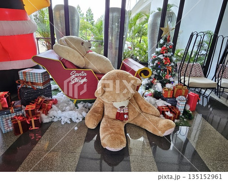 this is bear toy decoration with chrismas tree background this is bear toy decoration with chrismas tree background 135152961