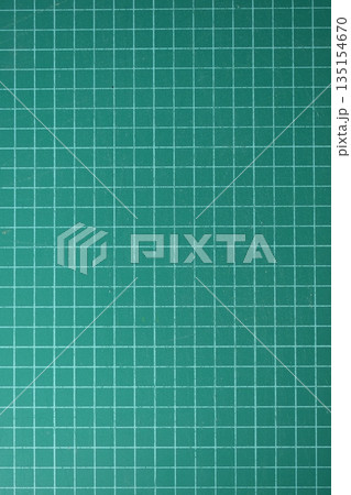 green cutting mat board background with line and scale measure guide pattern for object art design 135154670