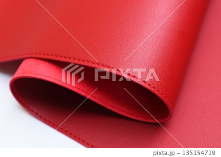 shiny red leather texture isolated on white background 135154719