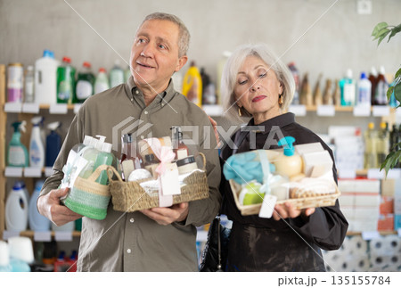 Senior spouses studies label and choose shower cosmetic present, packaged in basket 135155784