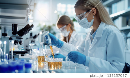 Doctor or researcher examines a sample, their expression focused and determined Doctor or researcher examines a sample, their expression focused and determined 135157057