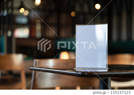 Stand Mock up Table tent menu card on blurred cafe bar background design key visual layout Stand Mock up Table tent menu card on blurred cafe bar background design key visual layout 135157125