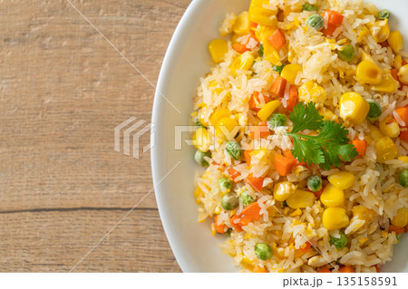 fried rice with mixed vegetable (carrot, green bean peas, corn) and egg fried rice with mixed vegetable (carrot, green bean peas, corn) and egg 135158591
