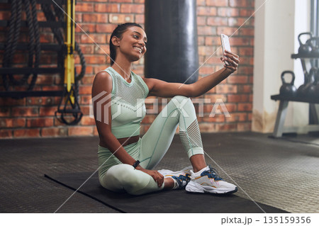 Gym, fitness or happy woman taking selfie on workout, exercise or training break for social media. Wellness, smile or healthy Indian girl smiling, relaxing or taking pictures for online post 135159356