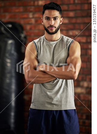 Fitness, muscle and portrait of man in gym with arms crossed for confidence, motivation and pride. Exercise, workout and serious face of confident bodybuilder, personal trainer or sports club owner. 135159477