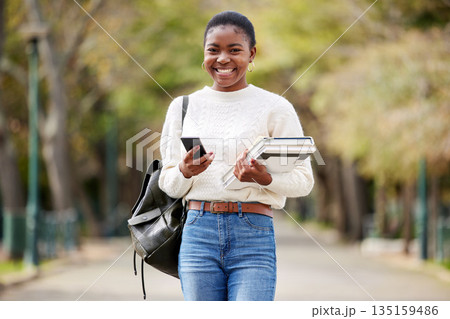 Portrait, phone and books with a student black woman on her commute to university campus for education. Mobile, social media and contact with a female college pupil checking for her next lecture Portrait, phone and books with a student black woman on her commute to university campus for education. Mobile, social media and contact with a female college pupil checking for her next lecture 135159486