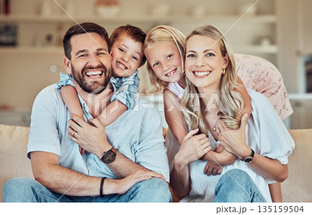 Portrait of parents, kids and smile on sofa for playful childhood, happiness and quality time in family home. Happy children, mother and father hug in living room for bonding, love and care together 135159504
