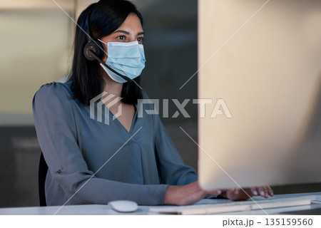 Call center, woman and face mask at computer for customer service, telemarketing sales and CRM consulting in office. Female agent, desktop and covid safety for online telecom advice, support and help Call center, woman and face mask at computer for customer service, telemarketing sales and CRM consulting in office. Female agent, desktop and covid safety for online telecom advice, support and help 135159560