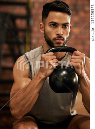 Weightlifting, training and man with kettle bell in gym for exercise, bodybuilder and fitness workout. Sports, muscle and serious male person squat with weight for wellness, healthy body and strength 135159578