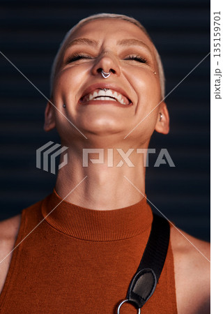 Young woman, laugh and portrait with hipster and gen z fashion with a happy smile and piercing. Cool style, face and funny joke of a female person laughing with happiness, confidence and jewelry 135159701