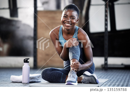 Relax, portrait or happy black woman at gym for a workout, exercise or training for healthy body or fitness. Face of sports girl or African athlete smiling or relaxing on break with positive mindset Relax, portrait or happy black woman at gym for a workout, exercise or training for healthy body or fitness. Face of sports girl or African athlete smiling or relaxing on break with positive mindset 135159788