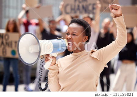 Equality, protest and black woman leader with megaphone and shouting loud for justice due to government problem. Justice, angry and person fist up for politics fight or freedom with frustrated group 135159821