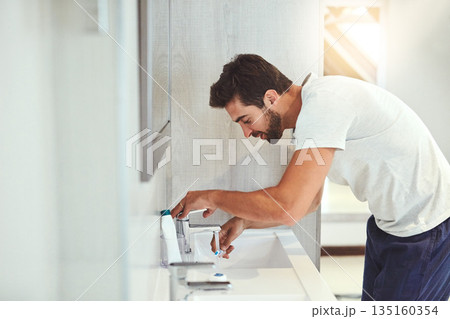 Dental, morning and brushing teeth with man in bathroom for cleaning, shower and oral hygiene. Smile, cosmetics and health with male person and toothbrush at home for self care, breath and mouth Dental, morning and brushing teeth with man in bathroom for cleaning, shower and oral hygiene. Smile, cosmetics and health with male person and toothbrush at home for self care, breath and mouth 135160354