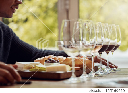 Wine tasting, cheese platter and luxury restaurant with alcohol and glass for customer. Eating, drink and sommelier with bottle for wines and food pairing in a fine dining and winery experience Wine tasting, cheese platter and luxury restaurant with alcohol and glass for customer. Eating, drink and sommelier with bottle for wines and food pairing in a fine dining and winery experience 135160630