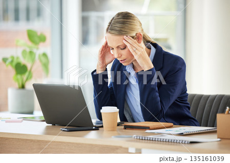 Professional, woman and working and frustrated with a headache in the office with entrepreneur. Stress, burnout and business person with fatigue, anxiety at a workplace with 404 glitch on laptop. Professional, woman and working and frustrated with a headache in the office with entrepreneur. Stress, burnout and business person with fatigue, anxiety at a workplace with 404 glitch on laptop. 135161039