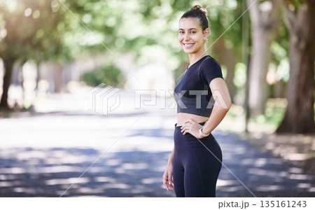 Portrait, runner or happy woman ready for fitness workout or body movement while relaxing on break. Resting, tired sports athlete or healthy girl in exercise training with smile or confidence in park 135161243