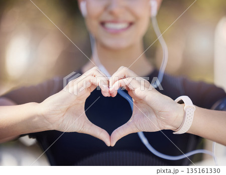 Healthy, heart hands or happy girl runner in park for fitness, exercise or workout for cardiovascular health. Love sign, hand gesture or blurry sports woman in sports training for wellness in nature Healthy, heart hands or happy girl runner in park for fitness, exercise or workout for cardiovascular health. Love sign, hand gesture or blurry sports woman in sports training for wellness in nature 135161330