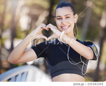 Runner, heart hands or portrait of happy woman in park for running exercise or workout for body health. Love sign, hand gesture or active girl athlete runner in sports training for fitness in nature 135161341
