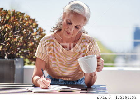 Writing, book and an old woman author sitting outdoor in summer for inspiration as a writer. Idea, planning and a senior female pensioner drinking coffee while using a pen to write in her diary Writing, book and an old woman author sitting outdoor in summer for inspiration as a writer. Idea, planning and a senior female pensioner drinking coffee while using a pen to write in her diary 135161355