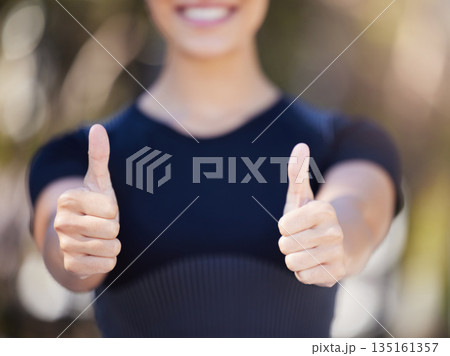 Runner, hands or woman with thumbs up in park for fitness training with positive mindset or smile. Workout motivation, blur closeup or girl smiling with like sign, hand gesture or thumb up in nature 135161357