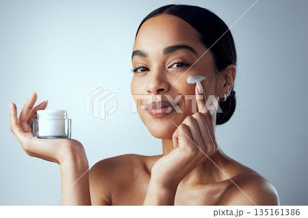 Face cream, skincare and woman in studio for dermatology, wellness and hydration on grey background. Portrait, sunscreen and lady model relax with collagen, mask and lotion, beauty or facial product Face cream, skincare and woman in studio for dermatology, wellness and hydration on grey background. Portrait, sunscreen and lady model relax with collagen, mask and lotion, beauty or facial product 135161386