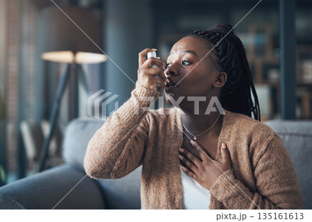 Asthma attack, medicine and a woman with inhaler to breathe in a house for health and wellness. Anxiety of a sick black person with medication for healthcare, lungs or chest and respiratory problem 135161613