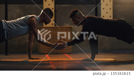 Fitness, high five and men with floor push up at a gym for support, motivation and training goals. Team, handshake and man with personal trainer for weight training, performance and workout routine 135161615