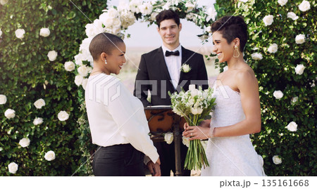 Love, marriage and lgbtq with lesbian couple at wedding for celebration, happy and bride pride. Smile, spring and ceremony with women at event for partner commitment, queer romance and freedom 135161668