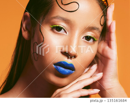 Makeup, neon cosmetic and portrait of woman in studio for cosmetics, eye shadow art and beauty. Creative color, aesthetic and face of female person with blue lipstick for glamour, fashion and style Makeup, neon cosmetic and portrait of woman in studio for cosmetics, eye shadow art and beauty. Creative color, aesthetic and face of female person with blue lipstick for glamour, fashion and style 135161684