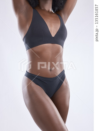 Body, fitness and beauty with black woman in studio for nutrition, weight loss and diet. Health, wellness and abdomen muscle with closeup of female model on white background for self care and glow Body, fitness and beauty with black woman in studio for nutrition, weight loss and diet. Health, wellness and abdomen muscle with closeup of female model on white background for self care and glow 135161857
