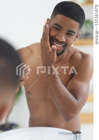 Happy man, face and beauty with mirror and skincare, hygiene and grooming during morning routine at home. Black male person smile in bathroom, fresh and clean facial with wellness and moisturizing 135161878
